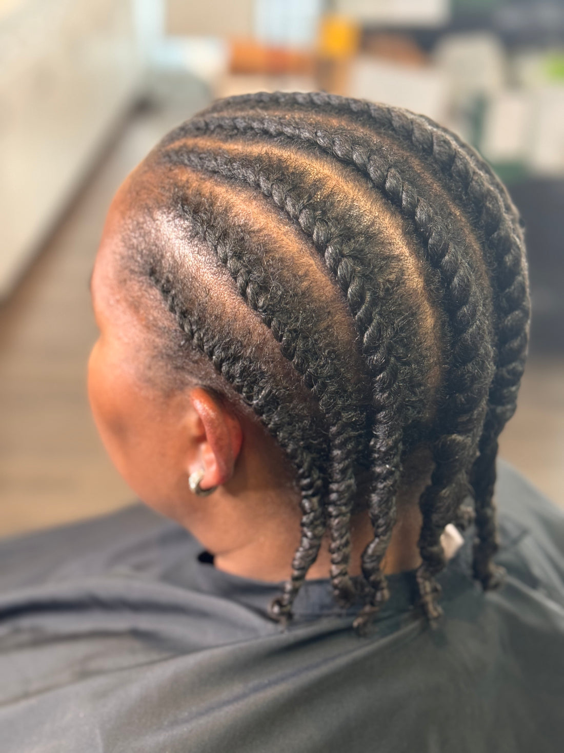 "Mastering the Two-Strand Flat Twist: A Step-by-Step Guide with Synergi Salon's Stay Glossing Mousse